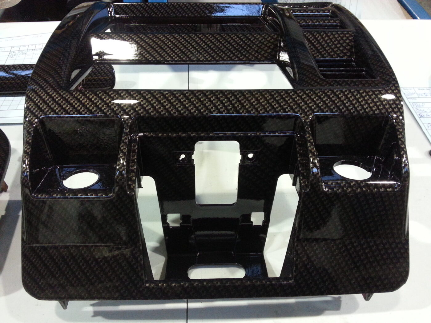 Car dashboard parts coated in carbon fibre hydrographic film painted black