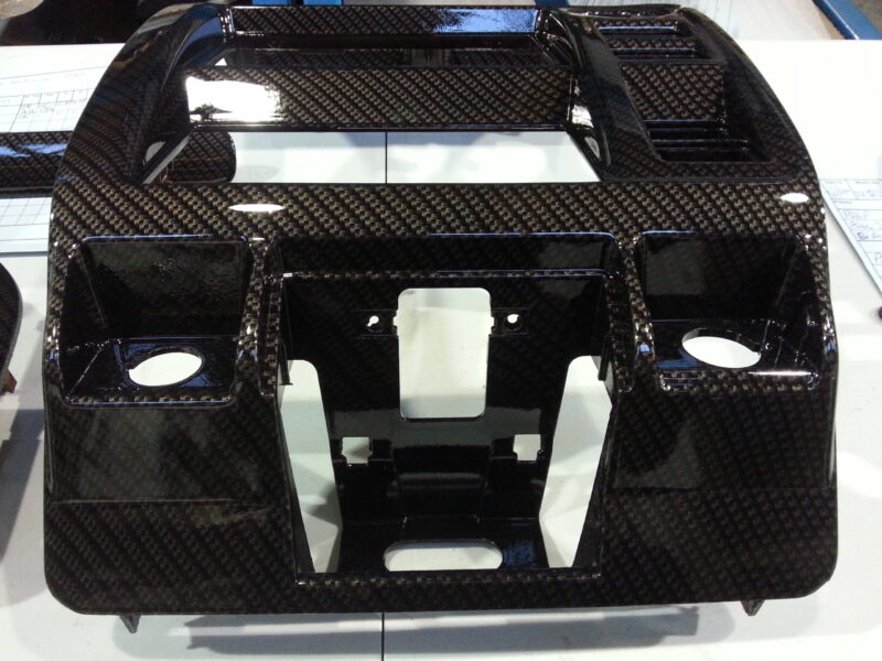 Car dashboard parts coated in carbon fibre hydrographic film painted black