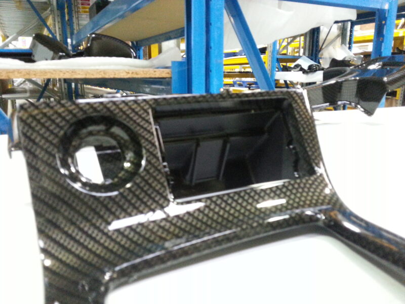 Car dashboard coated in carbon fibre hydrographic film painted black