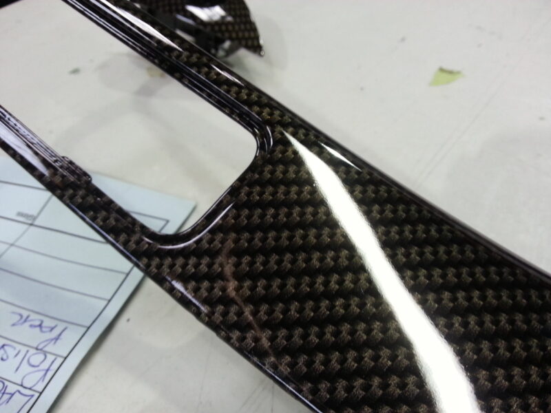 Car dashboard coated in carbon fibre hydrographic film painted black