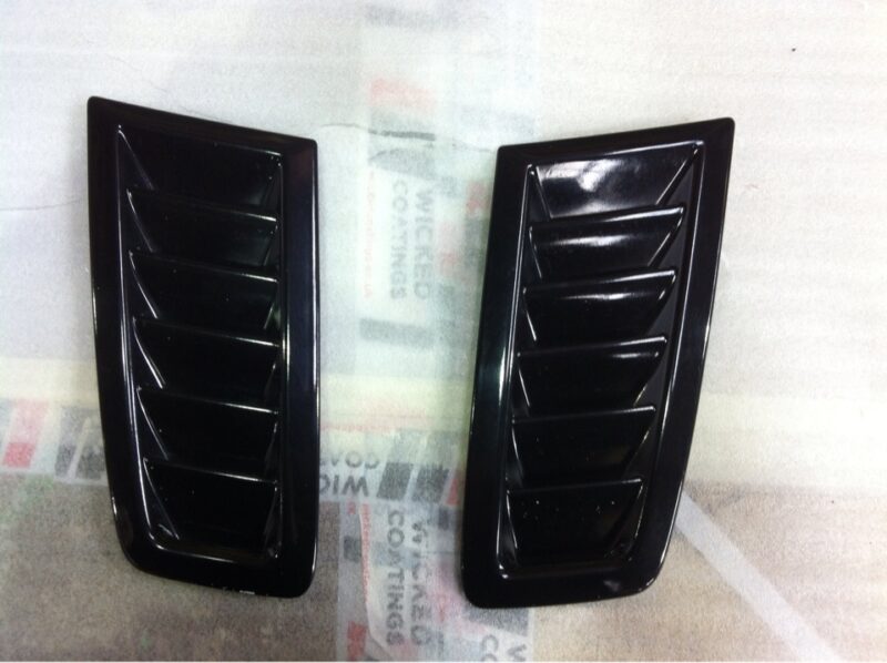 Car exterior element coated in carbon fibre hydrographic film painted black