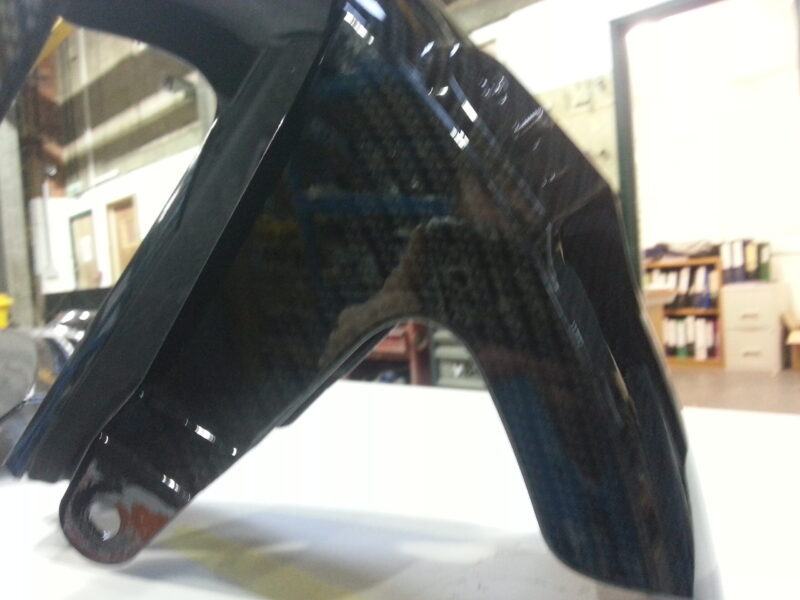 Motorbike element coated in carbon fibre hydrographic film painted black
