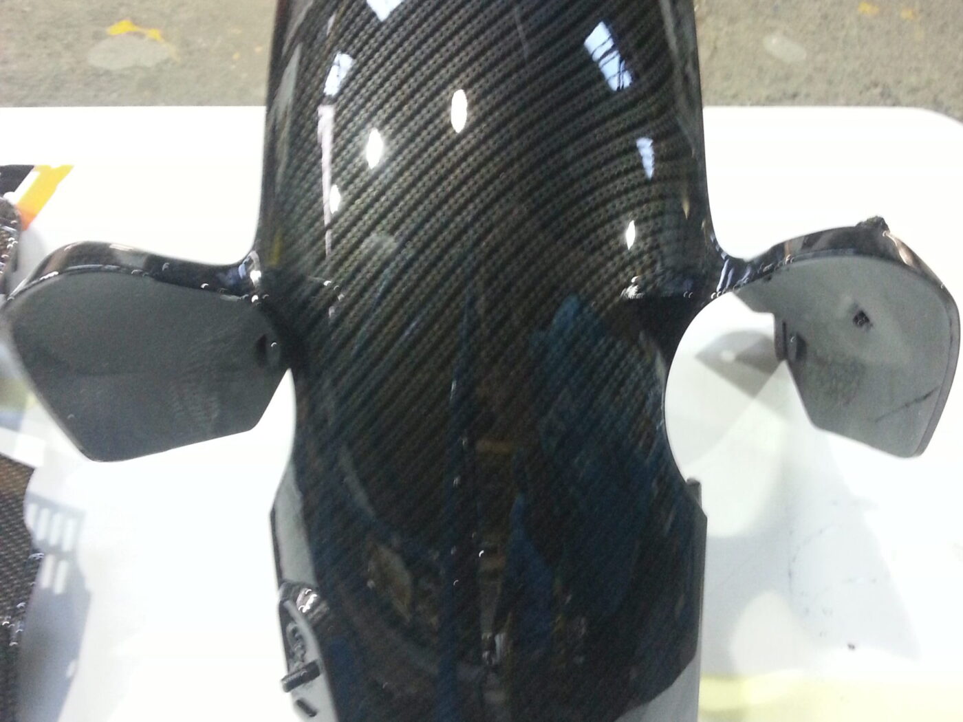 Motorbike element coated in carbon fibre hydrographic film painted black