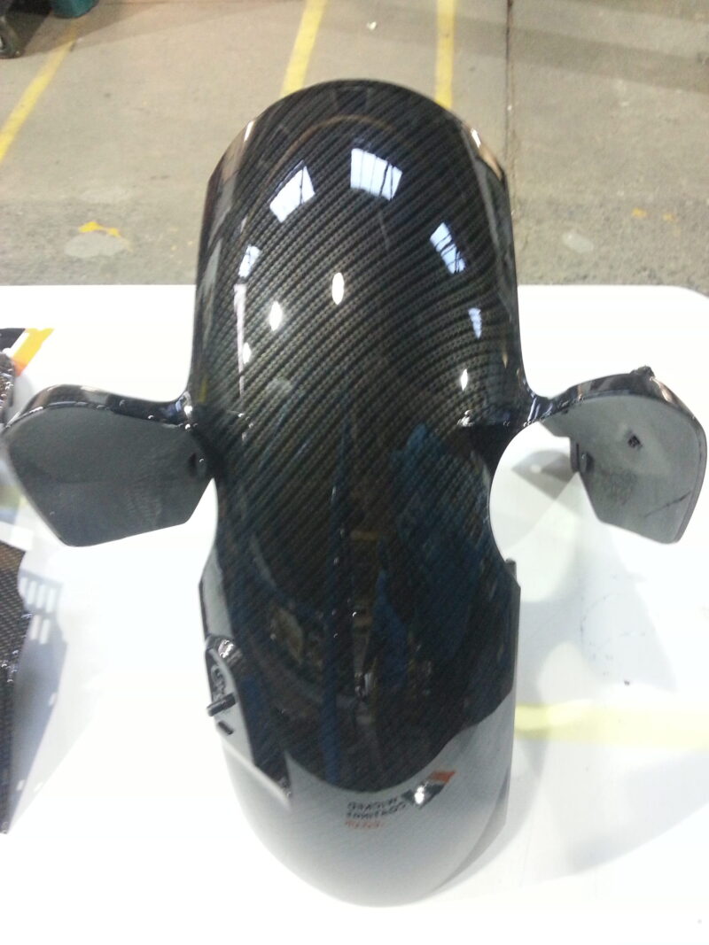 Motorbike element coated in carbon fibre hydrographic film painted black