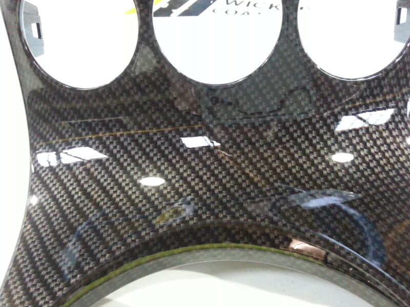 Car dashboard elements coated in carbon fibre hydrographic film painted black