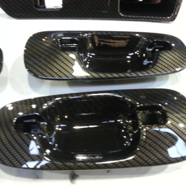 Car interior various elements coated in carbon fibre hydrographic film painted black