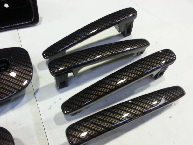 Car interior various elements coated in carbon fibre hydrographic film painted black