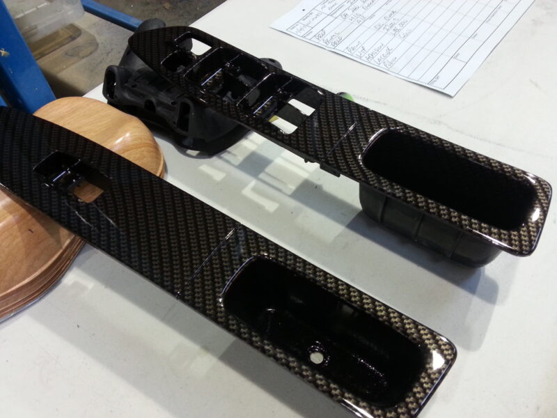 Car interior various elements coated in carbon fibre hydrographic film painted black