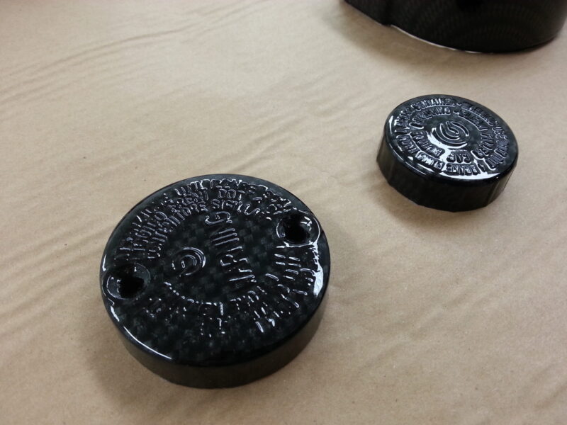 Motorbike elements coated in carbon fibre hydrographic film painted black